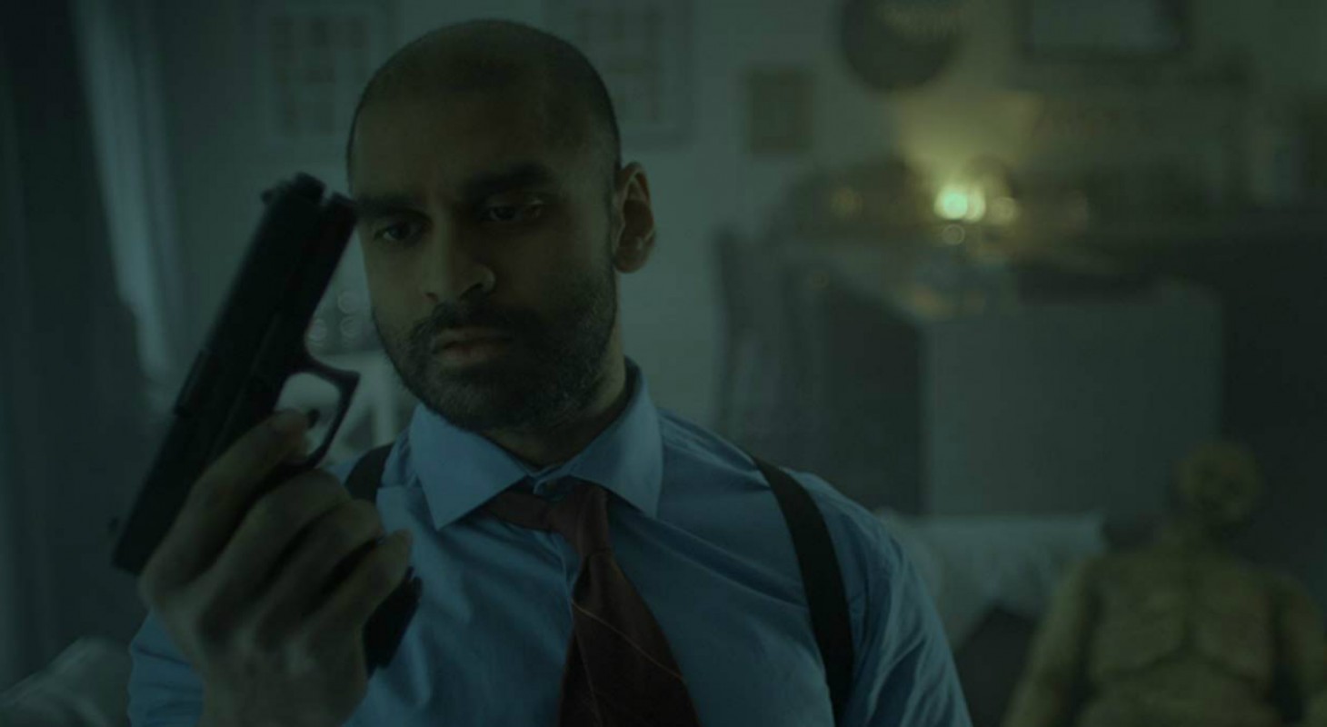 Lifechanger-Steve-Kasan-Holds-Gun