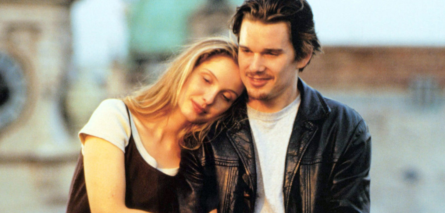 Julie Delpy leaning on Ethan Hawke's shoulder in Before Sunrise