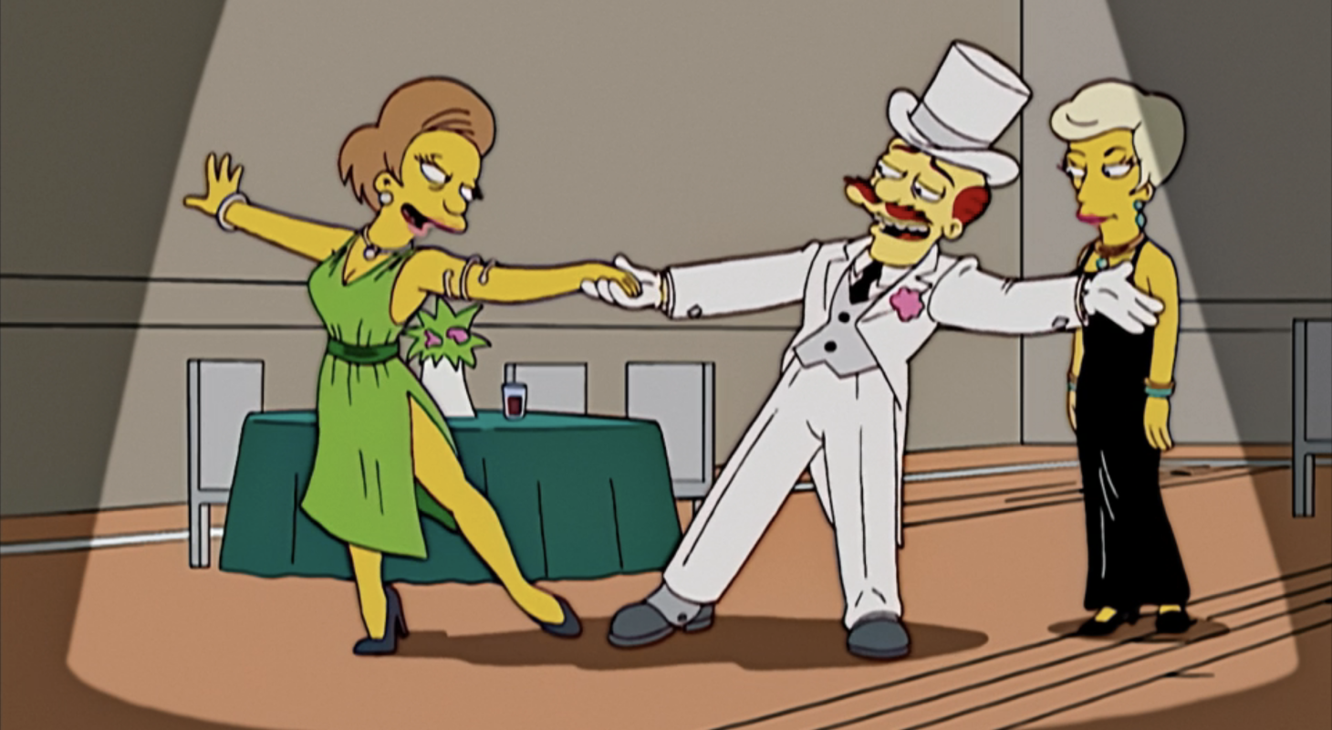 A dapper Groundskeeper Willie dances with Mrs. Krabappel in "My Fair Laddy," The Simpsons.