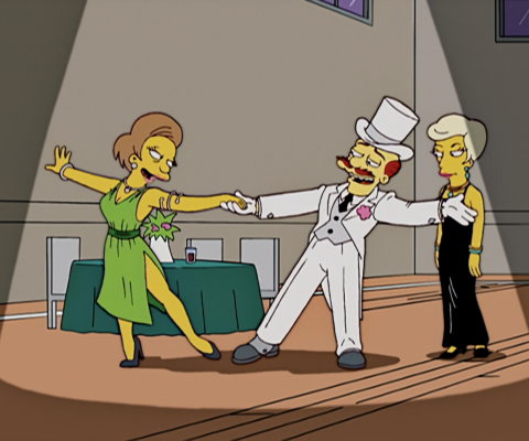 A dapper Groundskeeper Willie dances with Mrs. Krabappel in "My Fair Laddy," The Simpsons.