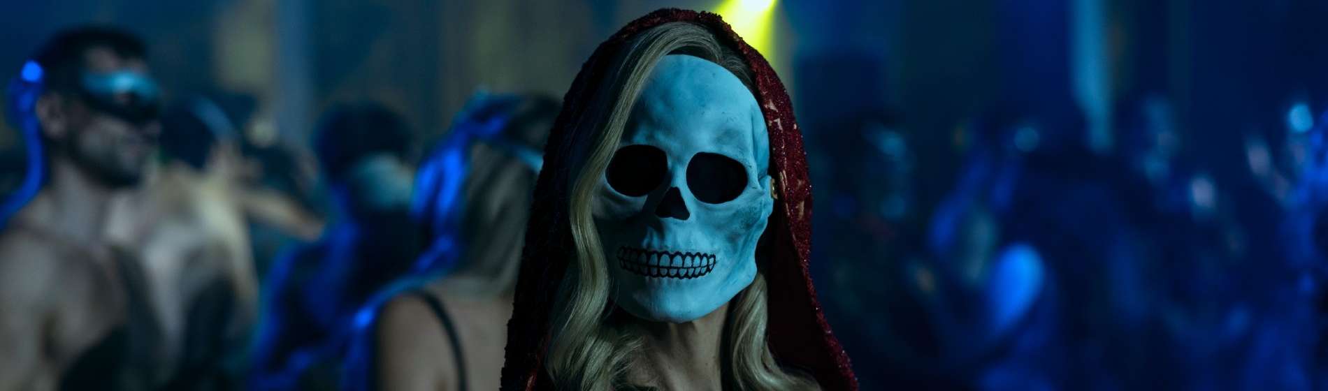 A mysterious woman with a skull mask.