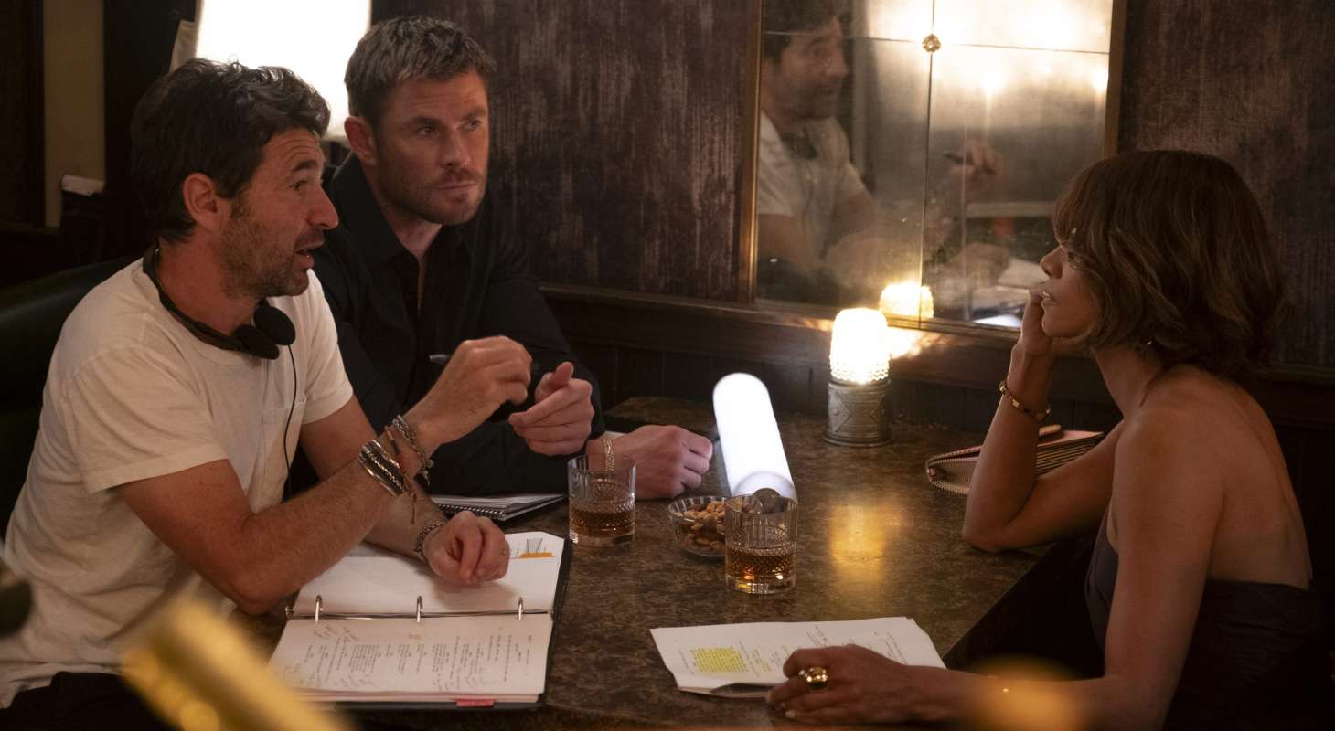 Director Bart Layton, Chris Hemsworth and Halle Berry on the set of Crime 101. Photo Credit: Merrick Morton
