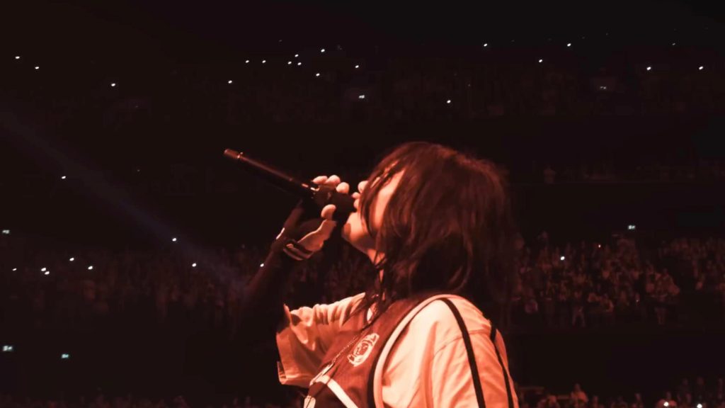 Billie Eilish performs on stage in a scene from HIT ME HARD AND SOFT: THE TOUR LIVE IN 3D