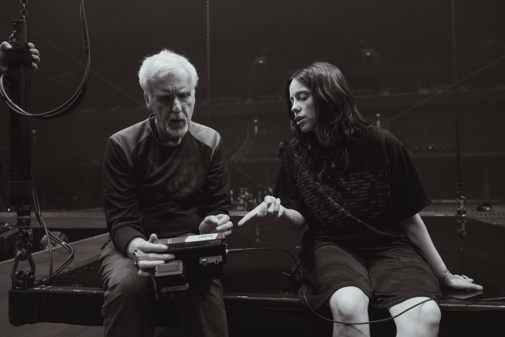 Co-Directors James Cameron and Billie Eilish review a shot from HIT ME HARD AND SOFT: THE TOUR LIVE IN 3D